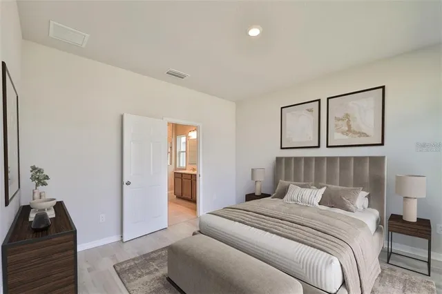 a bedroom with a bed and a couch