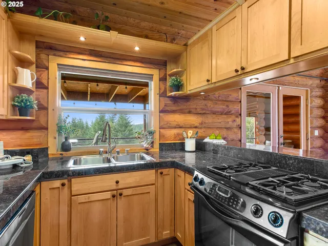 a kitchen with a stove and a white cabinets