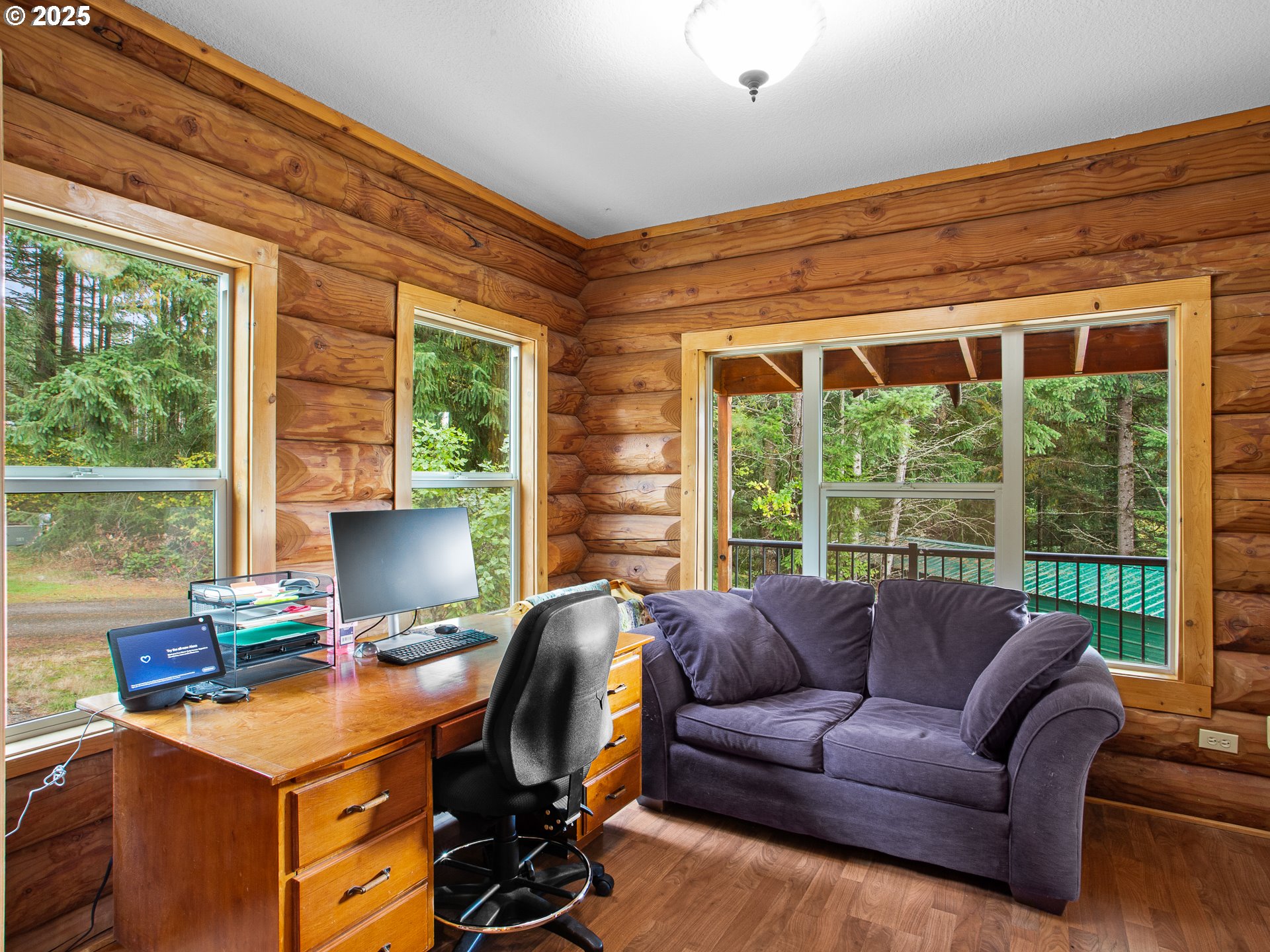 25520 Northeast 58th Street Vancouver, WA 98682 - Photo 18 of 48 a view of a workspace with furniture and a window