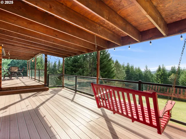 a view of balcony with wooden floor and outdoor seating
