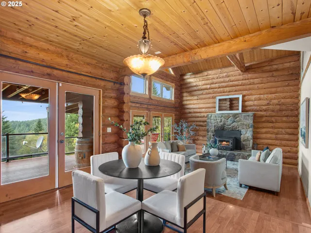 a view of a dining room with furniture wooden floor and a chandelier