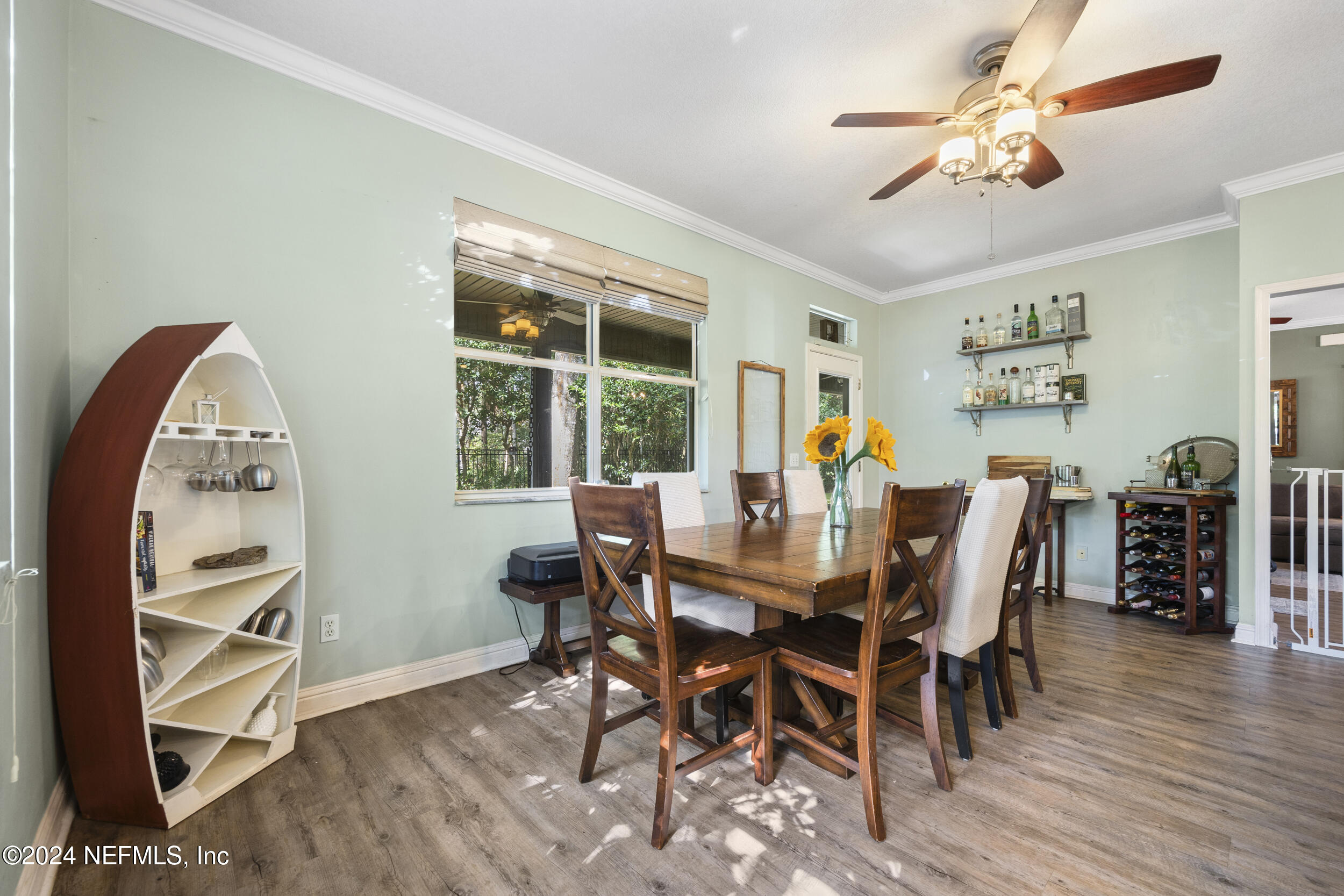 2338 Eagles Nest Road Jacksonville, FL 32246 - Photo 16 of 68 a view of a dining room with furniture and wooden floor