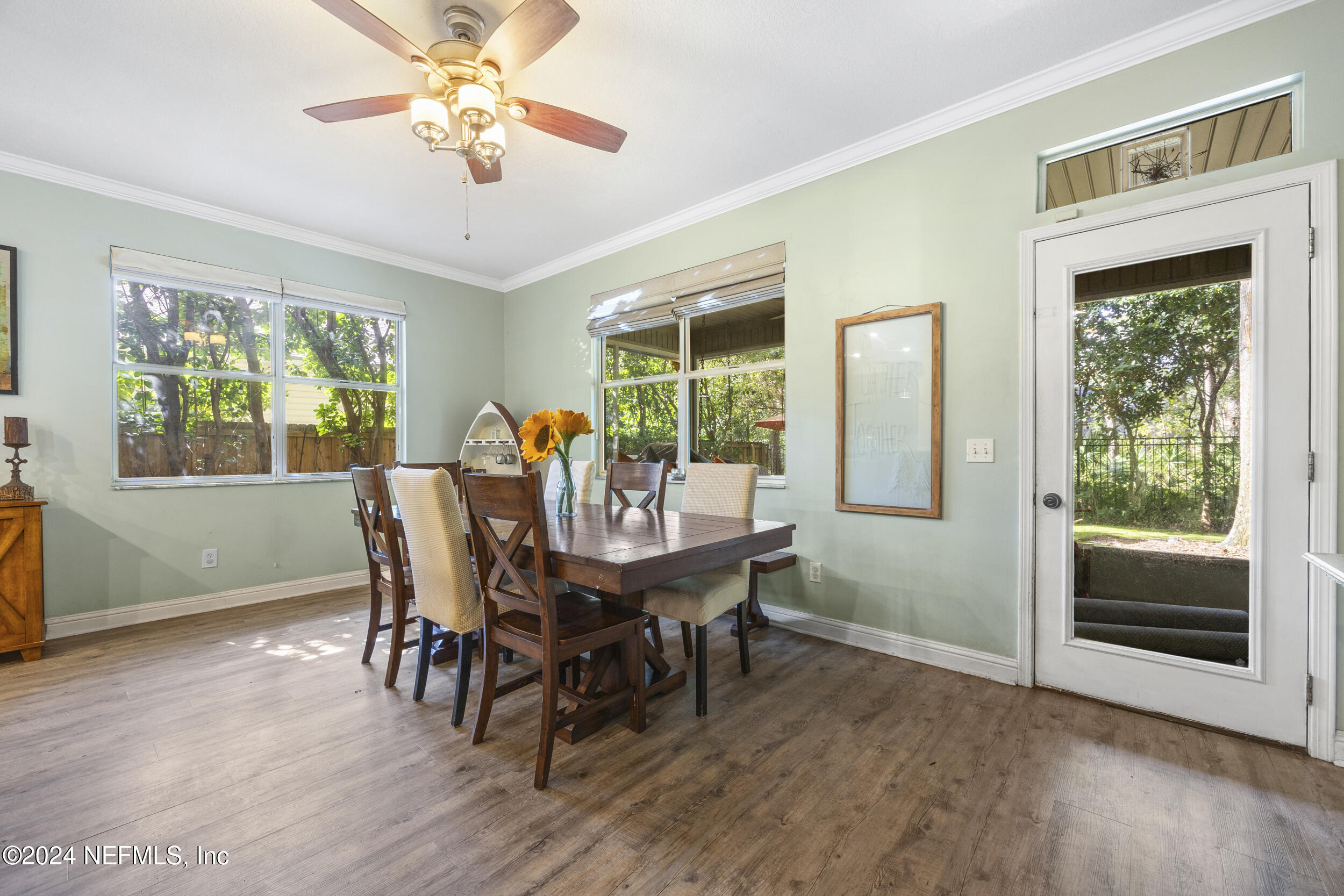 2338 Eagles Nest Road Jacksonville, FL 32246 - Photo 19 of 68 a view of a dining room with furniture window and wooden floor