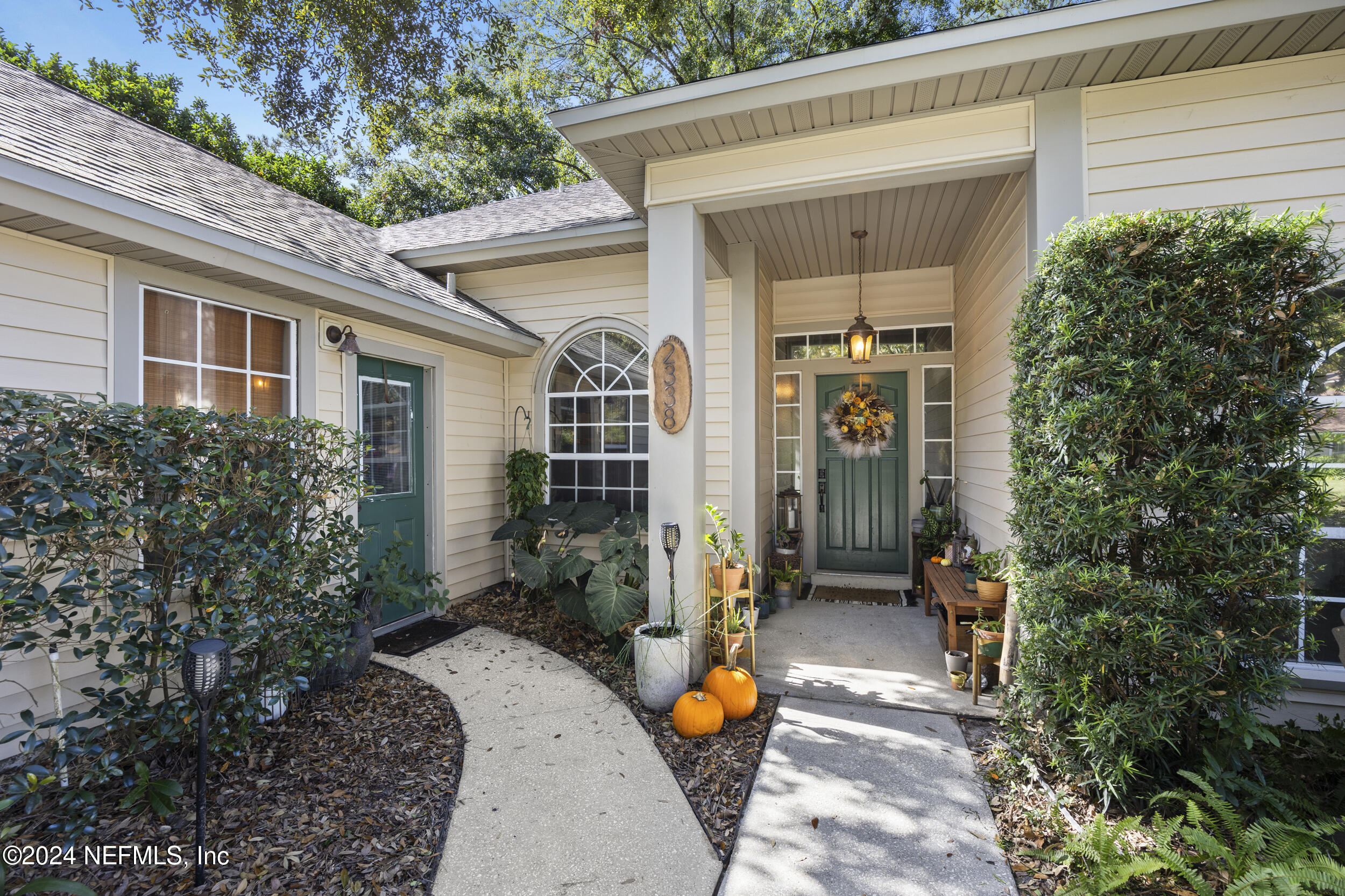 2338 Eagles Nest Road Jacksonville, FL 32246 - Photo 2 of 68 a front view of a house with garden
