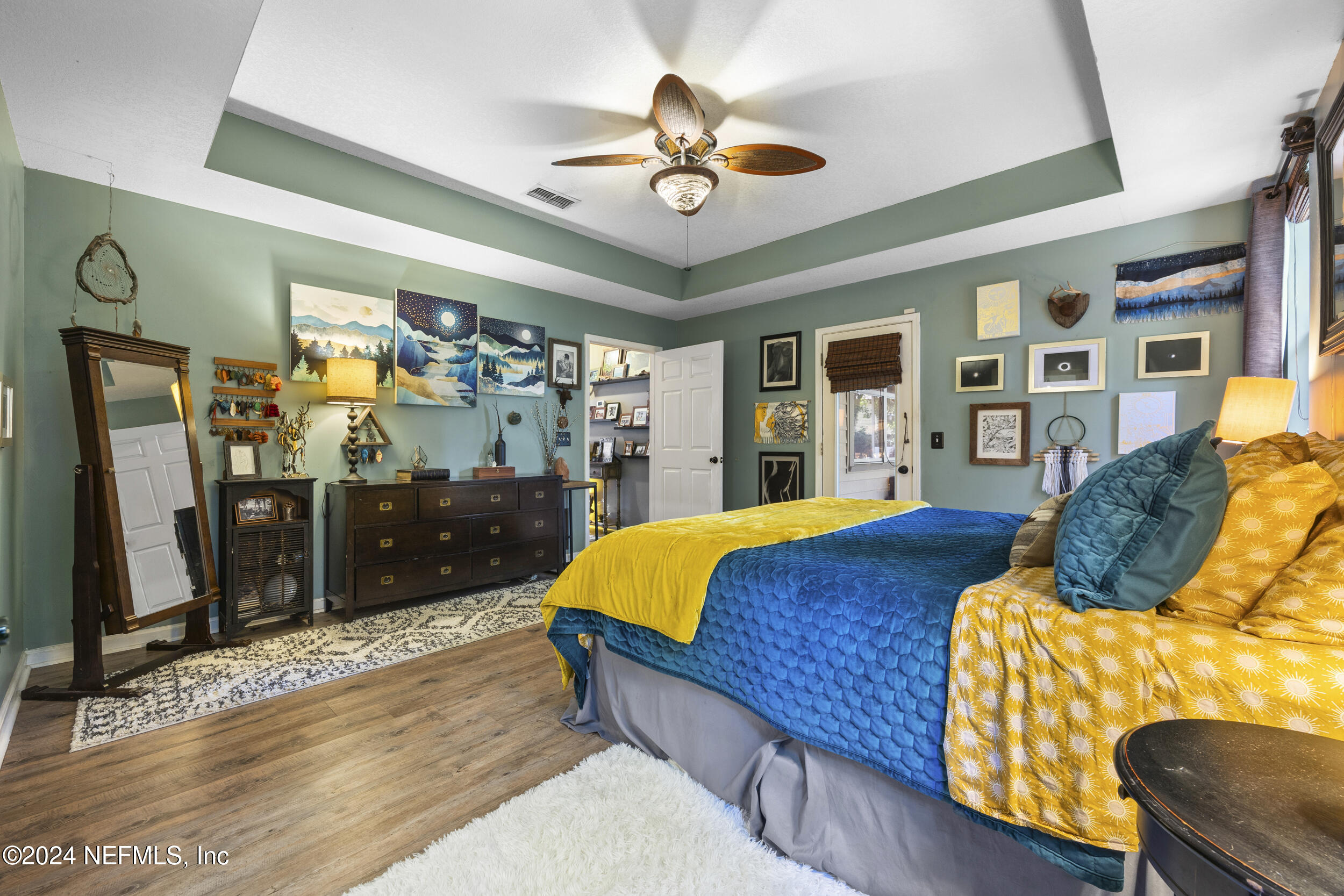 2338 Eagles Nest Road Jacksonville, FL 32246 - Photo 22 of 68 a bed sitting in a bedroom next to a window