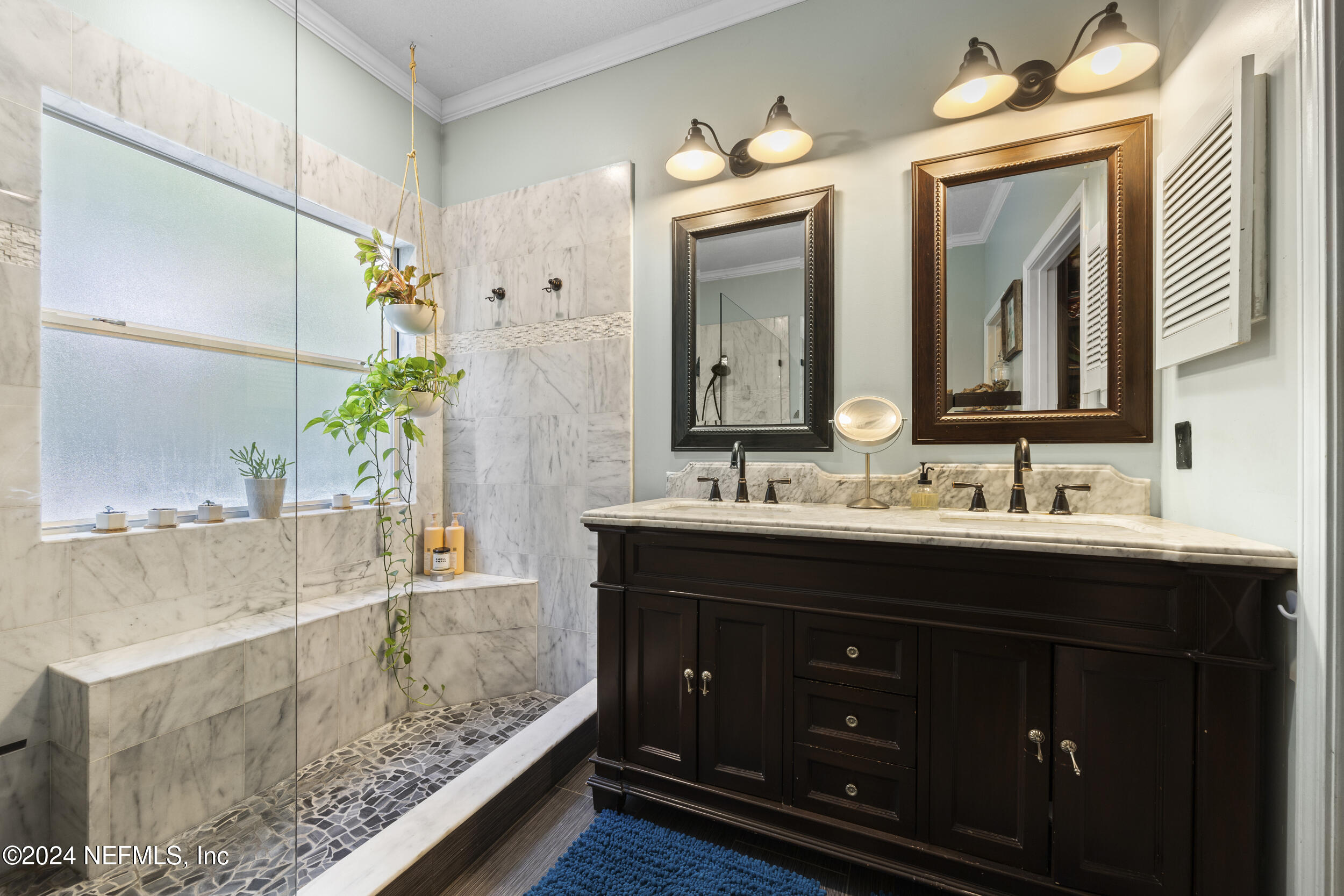 2338 Eagles Nest Road Jacksonville, FL 32246 - Photo 23 of 68 a bathroom with a double vanity sink mirror and bathtub