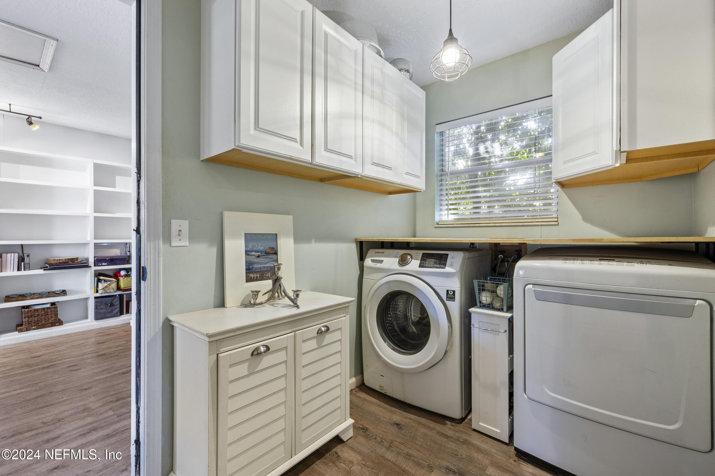 2338 Eagles Nest Road Jacksonville, FL 32246 - Photo 33 of 68 a view of washer and dryer with bathroom in the background