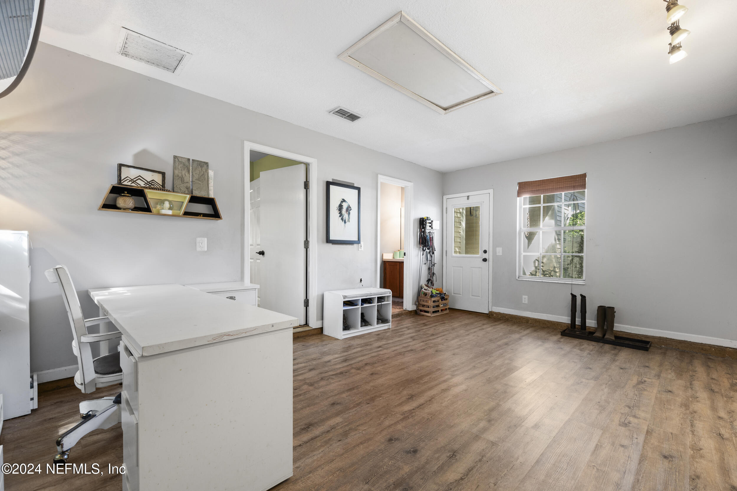 2338 Eagles Nest Road Jacksonville, FL 32246 - Photo 36 of 68 a view of a room with gym equipment and a window