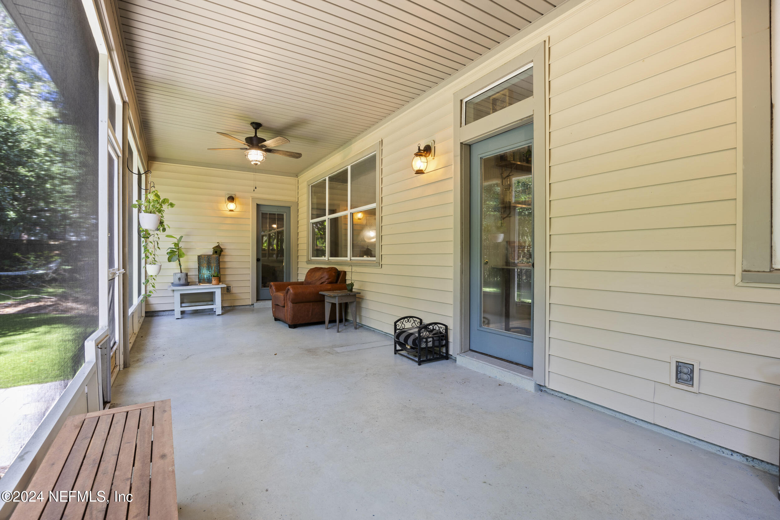 2338 Eagles Nest Road Jacksonville, FL 32246 - Photo 40 of 68 a view of a livingroom with furniture and floor to ceiling window