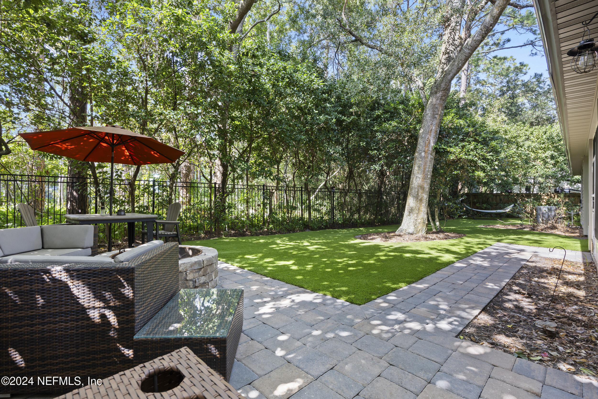 2338 Eagles Nest Road Jacksonville, FL 32246 - Photo 41 of 68 a view of backyard with seating space and trees