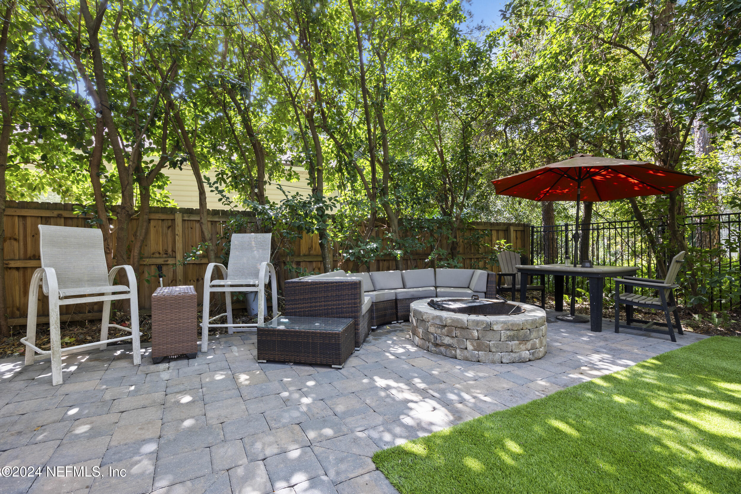 2338 Eagles Nest Road Jacksonville, FL 32246 - Photo 43 of 68 a view of a patio with chairs and a yard