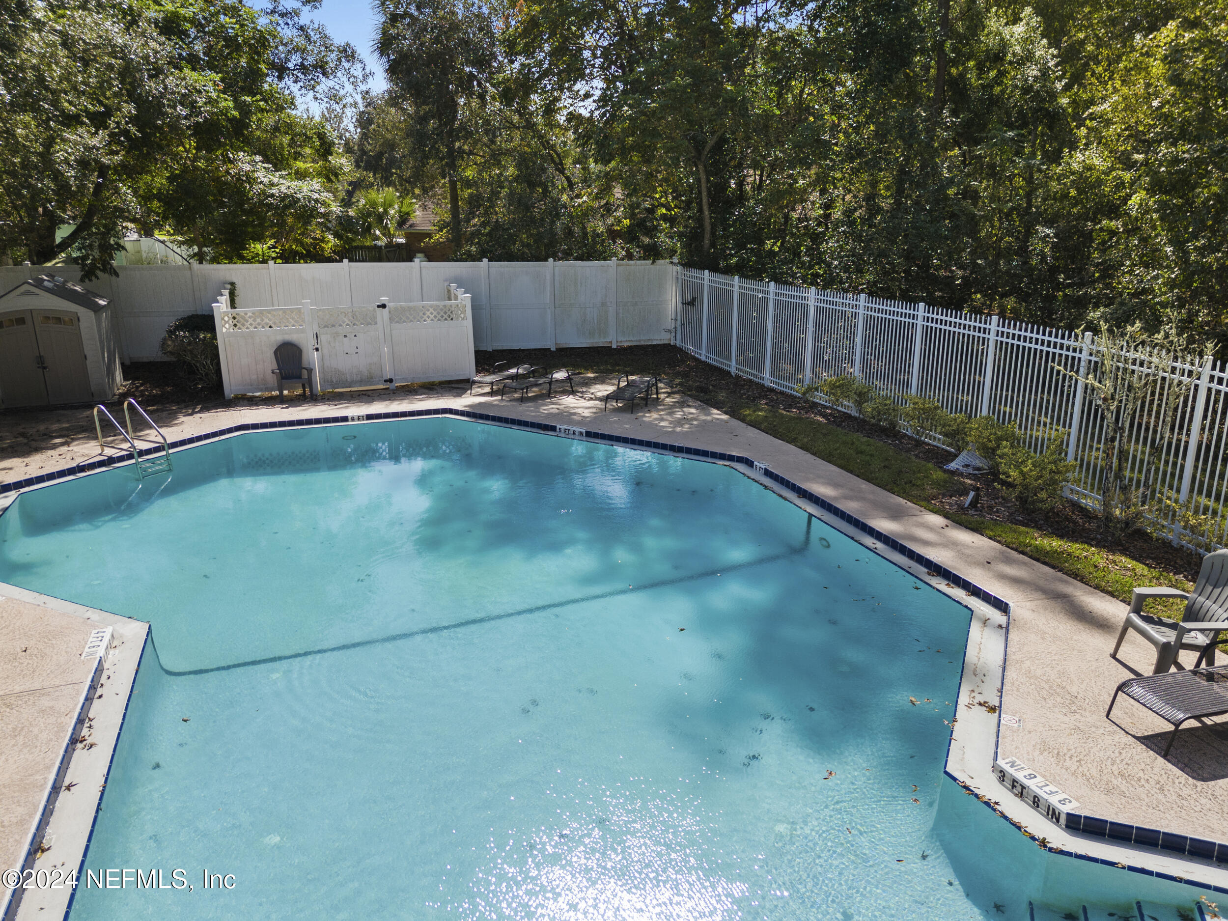 2338 Eagles Nest Road Jacksonville, FL 32246 - Photo 55 of 68 a view of a backyard with a small pool