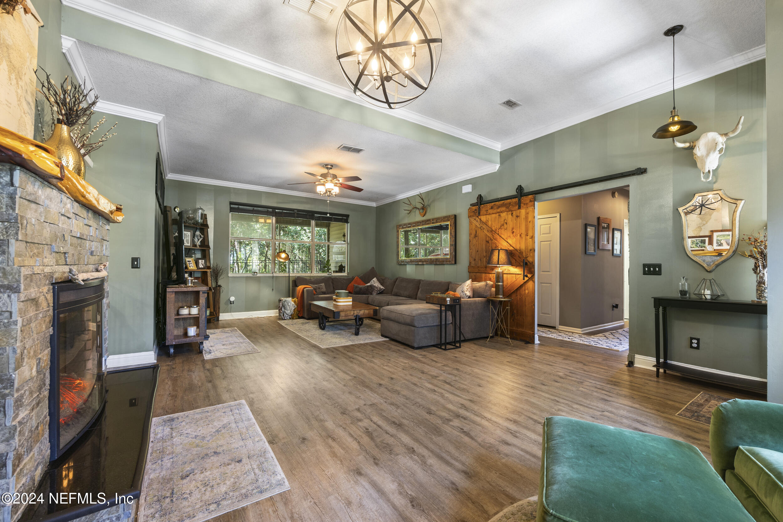 2338 Eagles Nest Road Jacksonville, FL 32246 - Photo 6 of 68 a living room with furniture and a fireplace