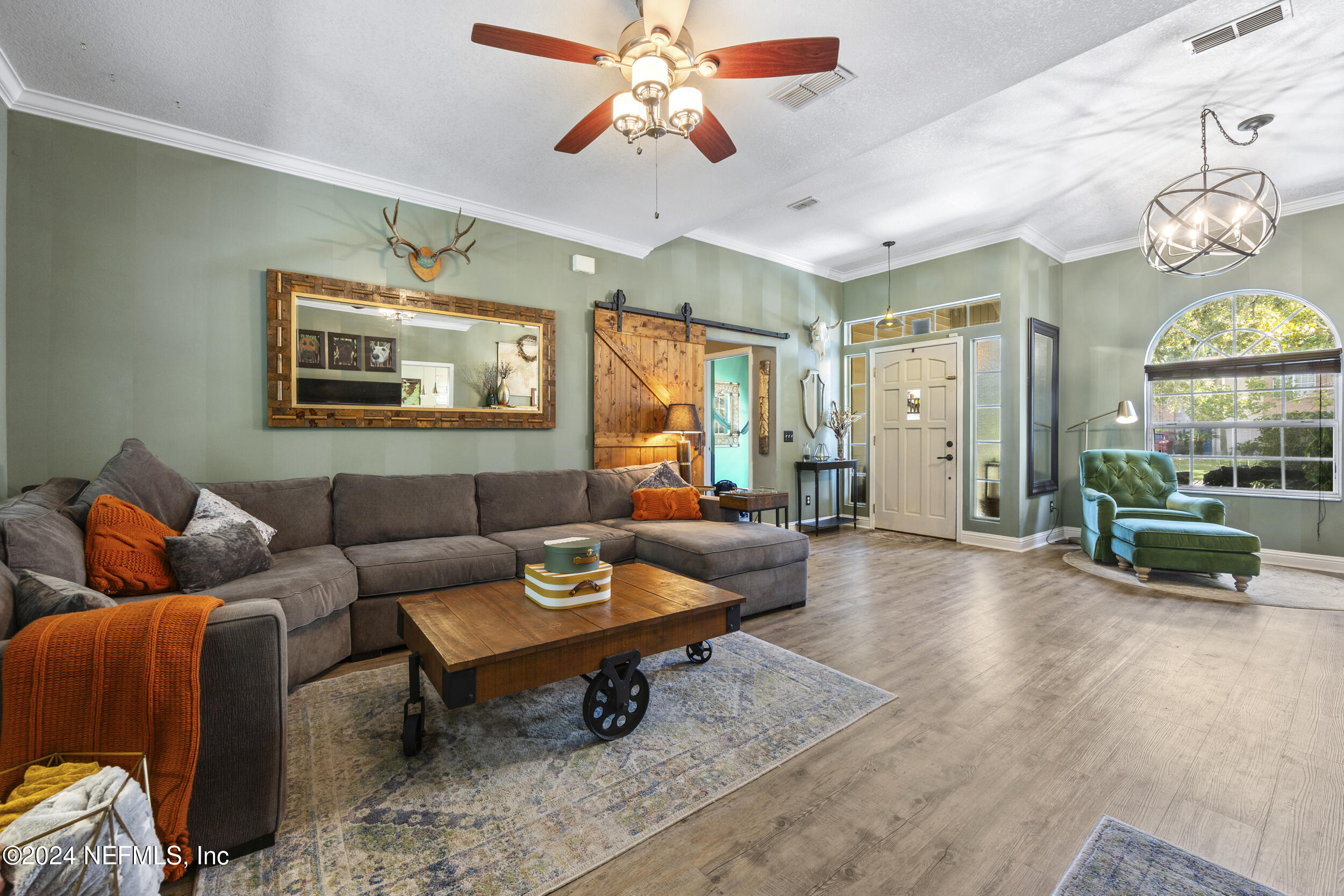 2338 Eagles Nest Road Jacksonville, FL 32246 - Photo 9 of 68 a living room with furniture and wooden floor