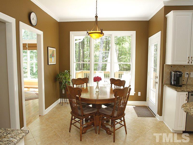 5813 Ventry Court Raleigh, NC 27613 - Photo 5 of 12 a view of a dining room with furniture window and outside view