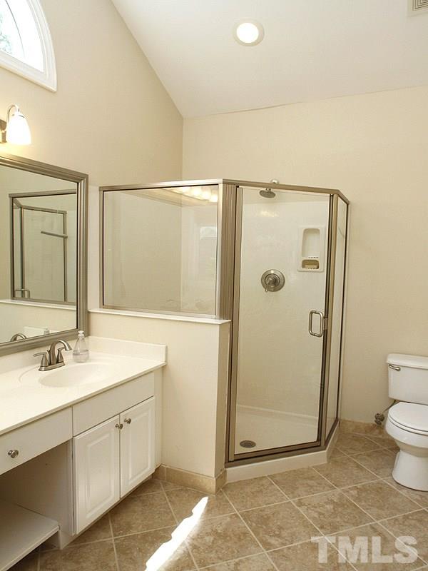 5813 Ventry Court Raleigh, NC 27613 - Photo 8 of 12 a bathroom with a granite countertop sink toilet and shower