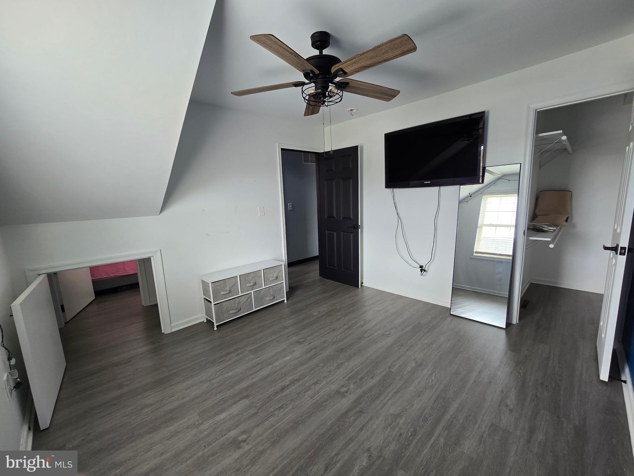 7513 Saffron Court Hanover, MD 21076 - Photo 20 of 42 a living room with wooden floor and ceiling fan