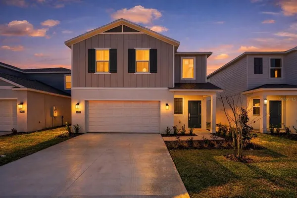 a front view of a house with yard