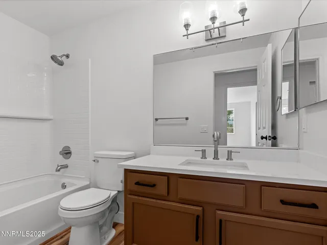 a bathroom with a sink a toilet and a bathtub