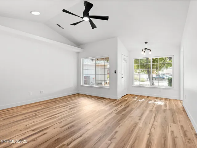 a view of room window and wooden floor