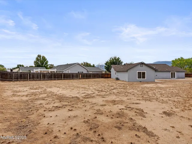 a backyard of a house with lots of green space