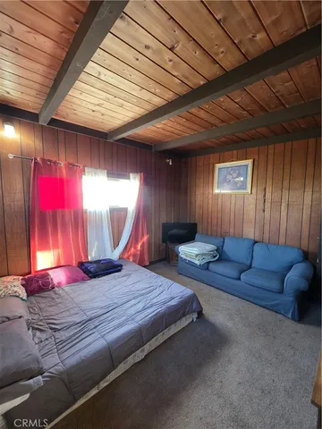 a view of a yard with wooden fence