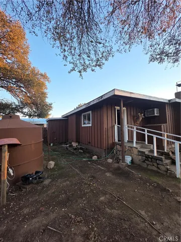 a view of a house next to a yard