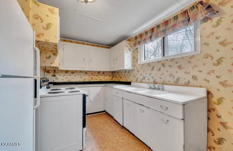 140 Bethel Road Clinton, TN 37716 - Photo 8 of 19 a kitchen with stainless steel appliances granite countertop a sink and a microwave
