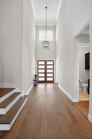 a view of a room with window and a ceiling fan