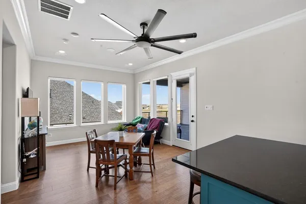 a view of a livingroom with furniture and a large window