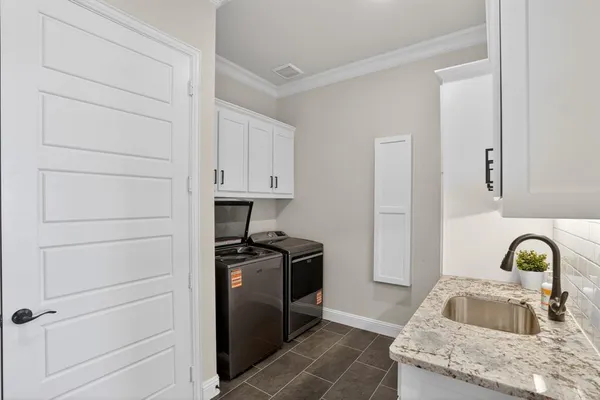 a kitchen with a sink and cabinets