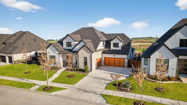 a house with swimming pool in front of it