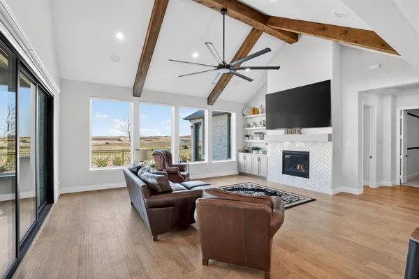 a living room with fireplace furniture and a flat screen tv