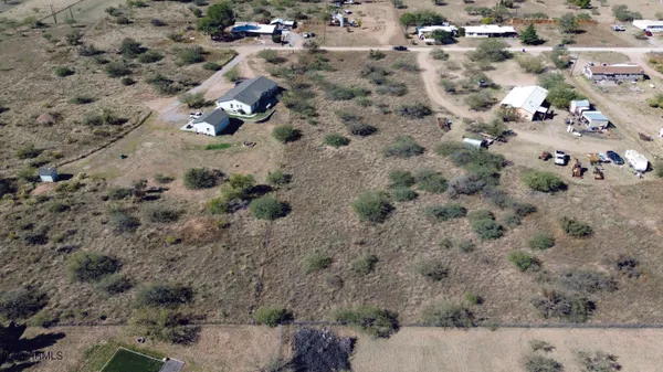 an aerial view of house with yard