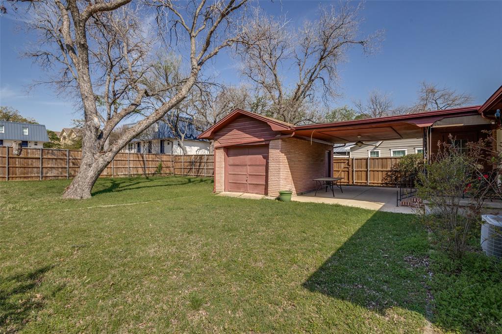 433 Fulton Street Denton, TX 76201 - Photo 25 of 25 a view of a yard in front of a house with a large tree