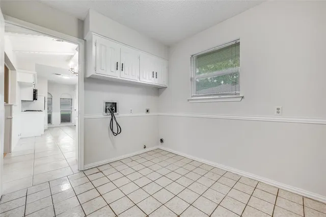 a view of a kitchen with wooden floor and cabinet