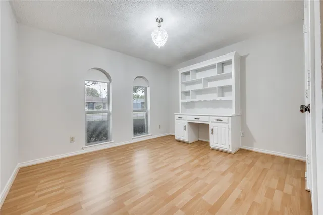 a view of a room with a fireplace and windows