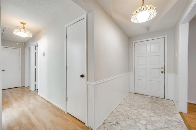 a view of an entryway with a chandelier