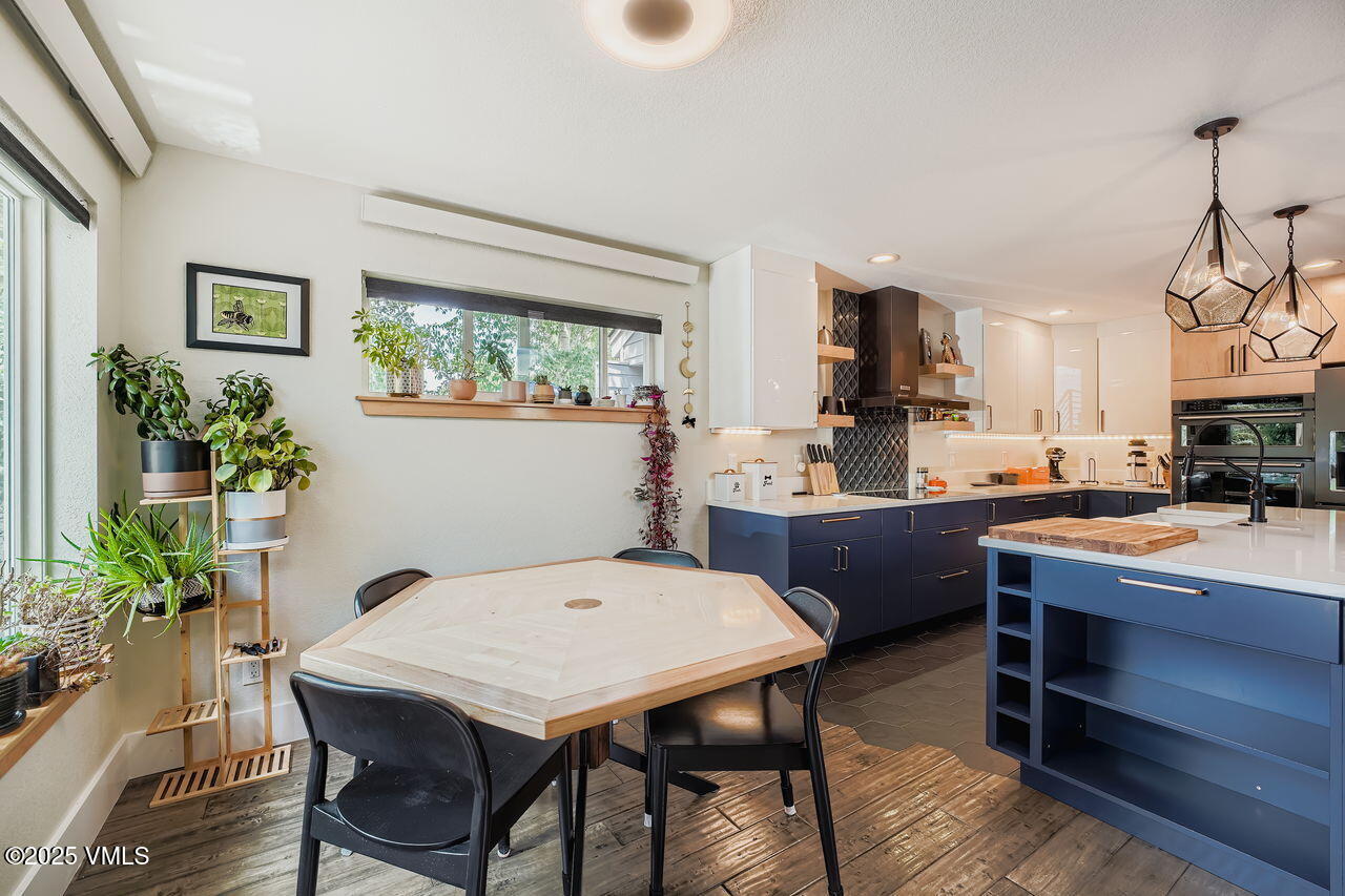 22 Wellington Lane, Unit 2 Edwards, CO 81632 - Photo 11 of 32 a view of kitchen with kitchen island dining table and chairs