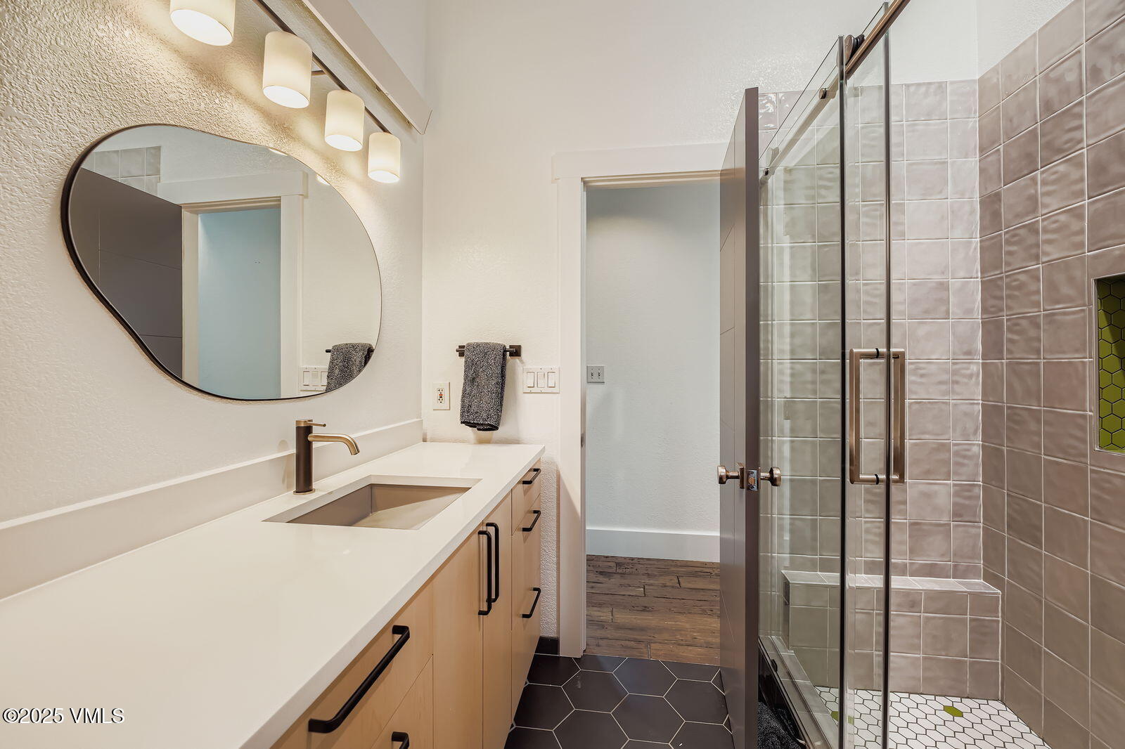 22 Wellington Lane, Unit 2 Edwards, CO 81632 - Photo 17 of 32 a bathroom with a double vanity sink mirror and shower