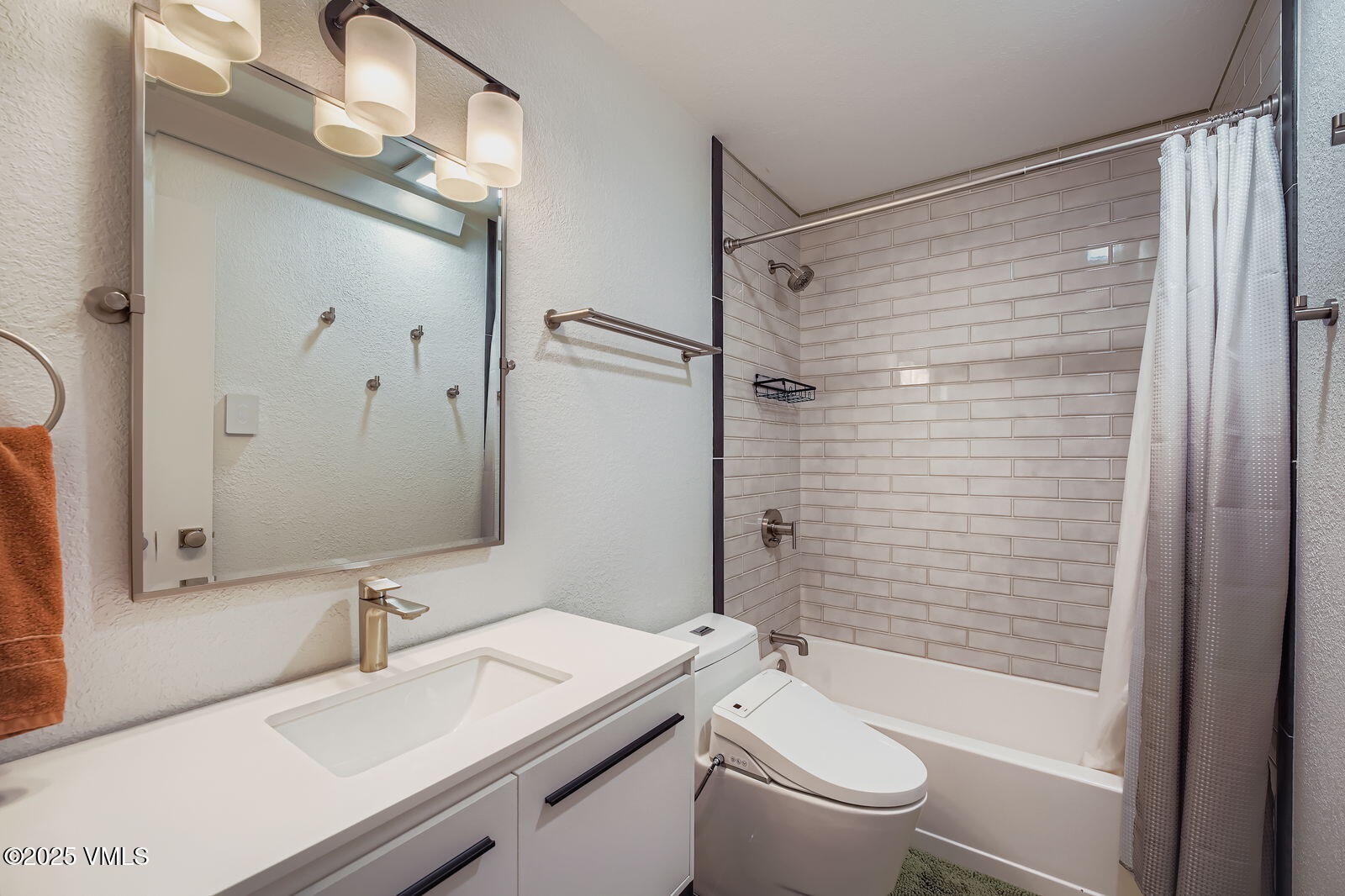 22 Wellington Lane, Unit 2 Edwards, CO 81632 - Photo 19 of 32 a bathroom with a sink a toilet and shower