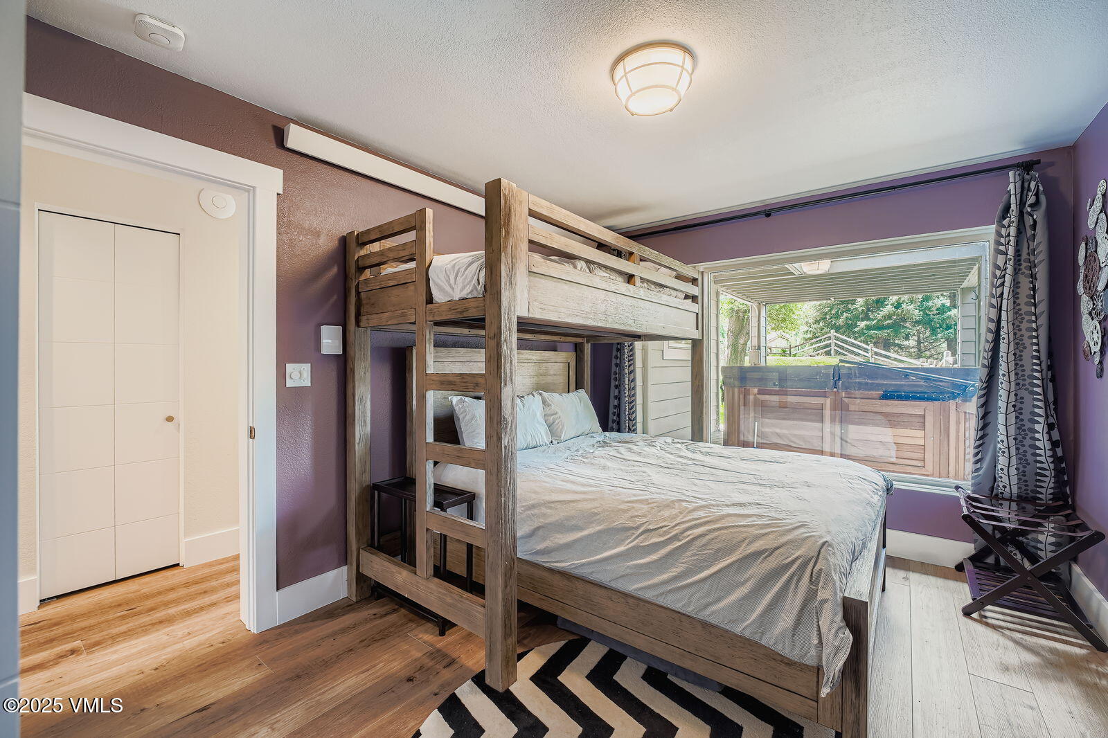 22 Wellington Lane, Unit 2 Edwards, CO 81632 - Photo 21 of 32 a bedroom with a bed and a large window