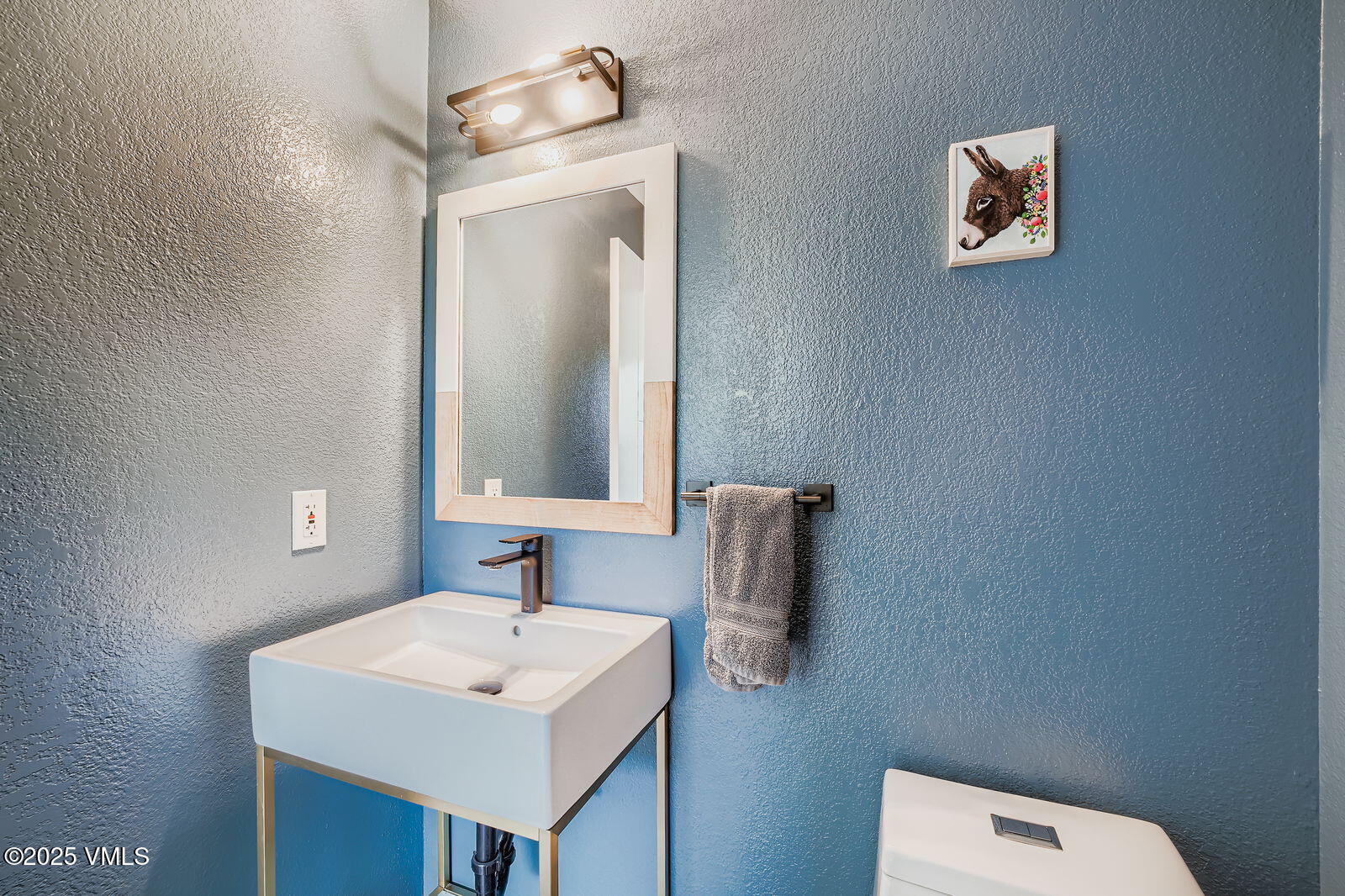 22 Wellington Lane, Unit 2 Edwards, CO 81632 - Photo 22 of 32 a bathroom with a sink and a mirror