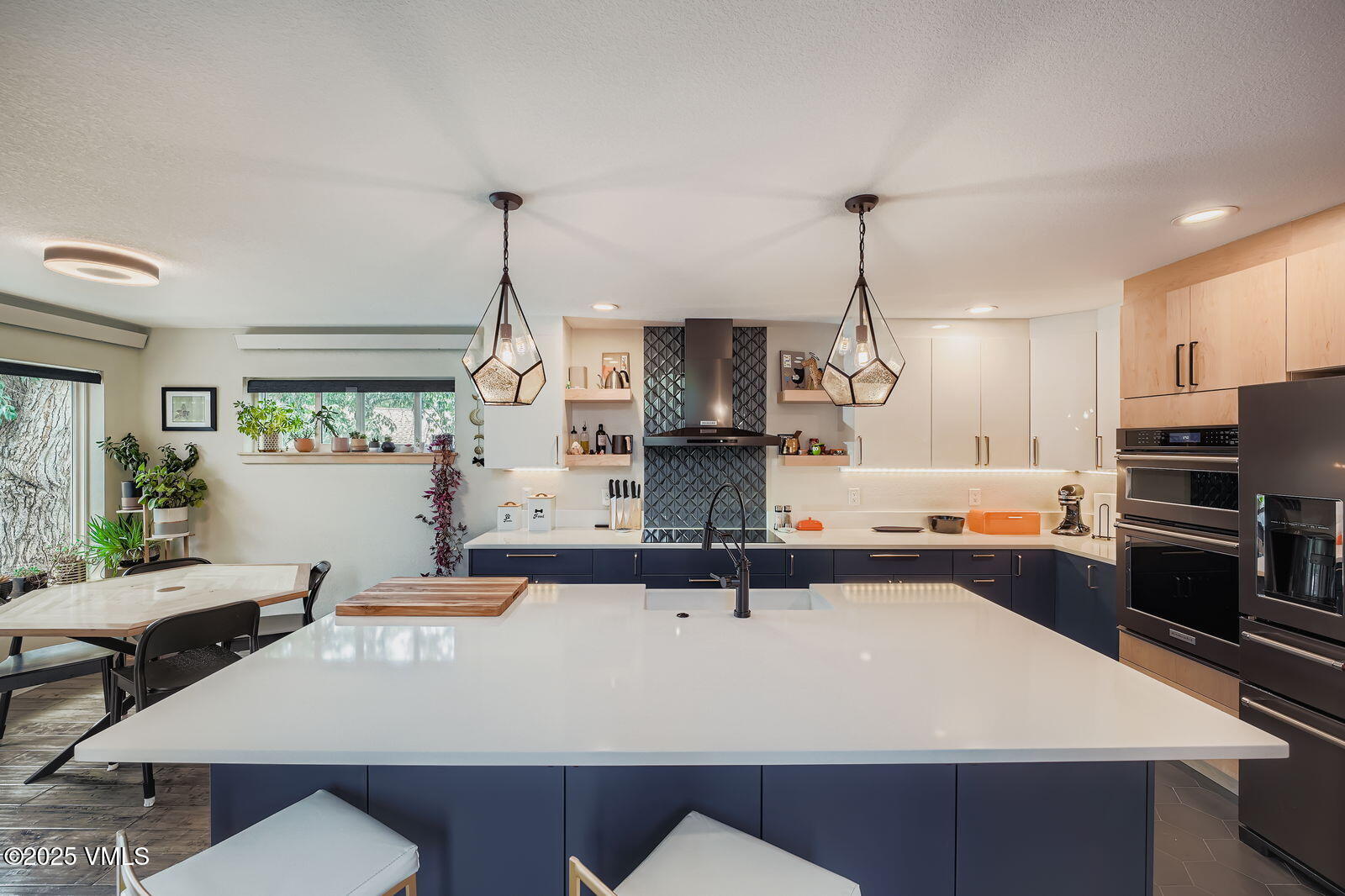 22 Wellington Lane, Unit 2 Edwards, CO 81632 - Photo 4 of 32 a kitchen with kitchen island a counter top space a sink and appliances