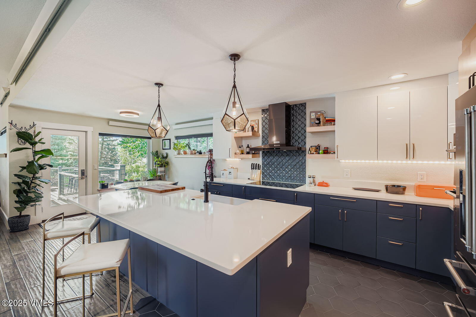 22 Wellington Lane, Unit 2 Edwards, CO 81632 - Photo 5 of 32 a kitchen that has a sink and a table in it