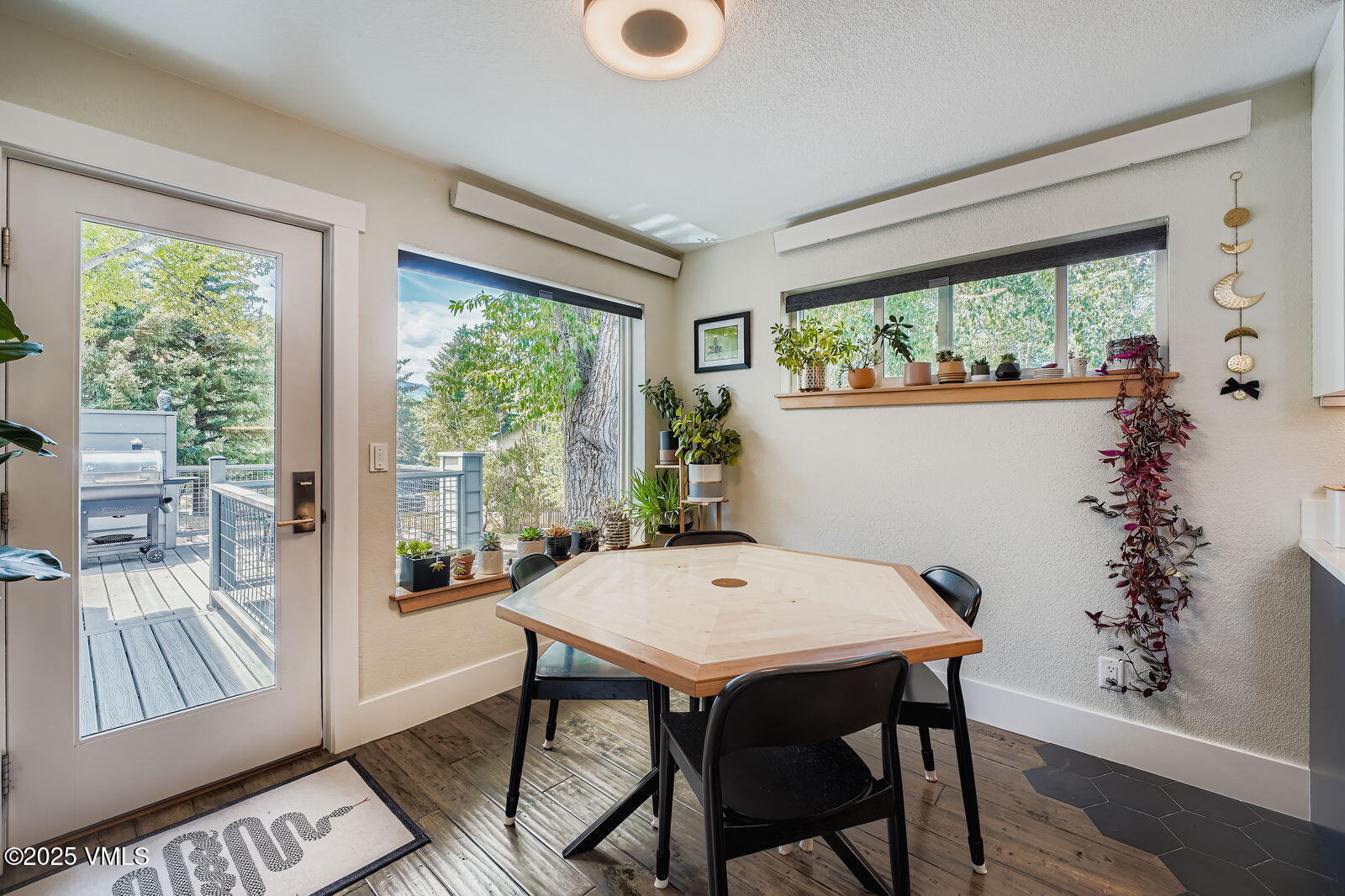 22 Wellington Lane, Unit 2 Edwards, CO 81632 - Photo 7 of 32 a view of a dining room with furniture large windows and wooden floor