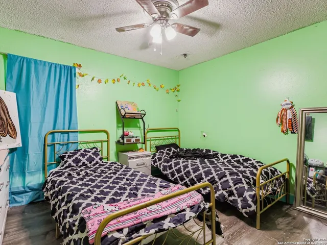 a bedroom with double bed and a window