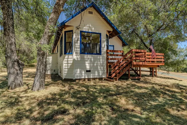 an aerial view of a houses with a yard
