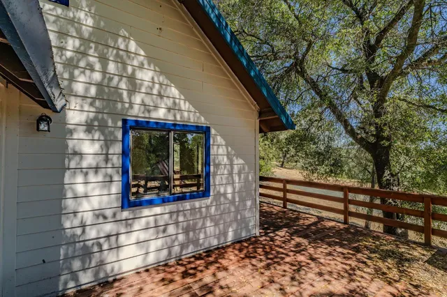 a view of a house with a yard and garage