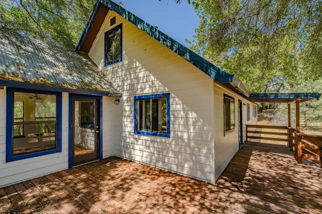 a view of an empty room with wooden walls